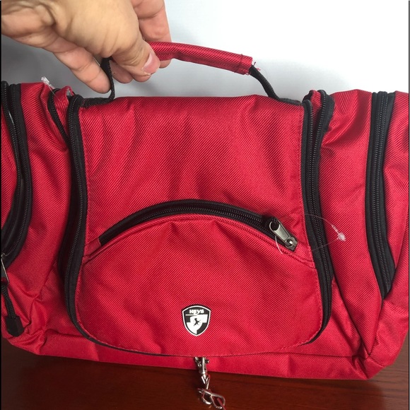 Heye’s pristine toiletry bag in bright red! - Picture 1 of 9